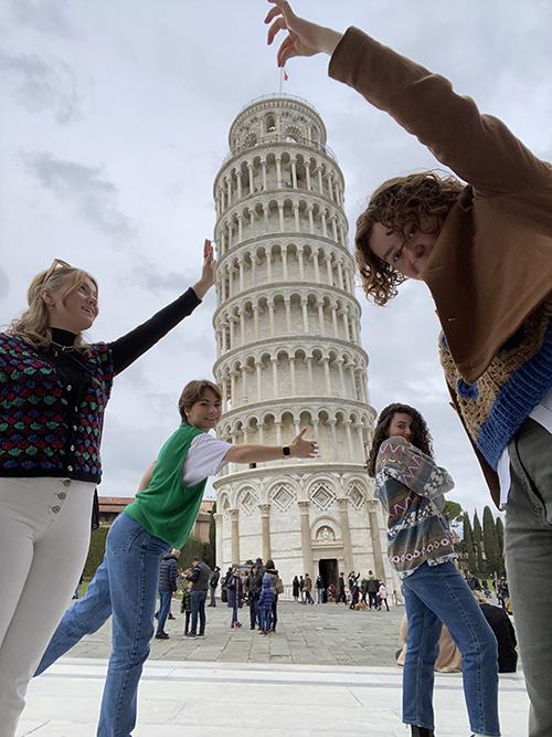 Architecture students in Italy with the Leaning Tower of Pisa. 